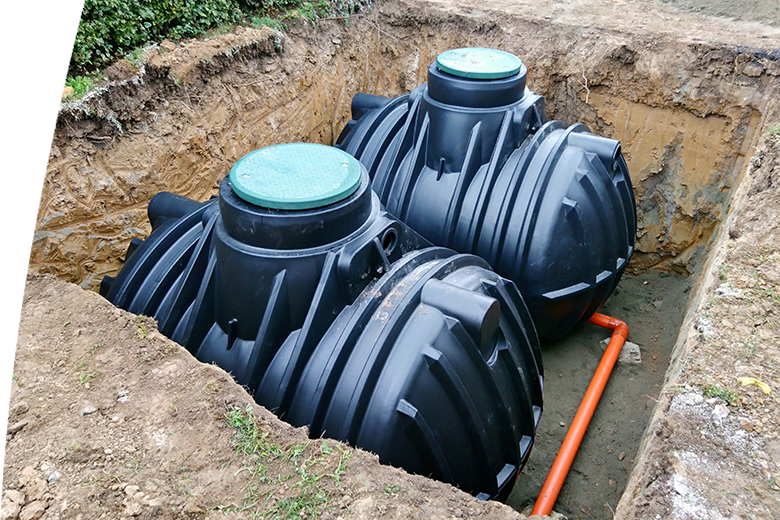 Underground rainwater harvesting tanks installed below ground level for water collection and storage